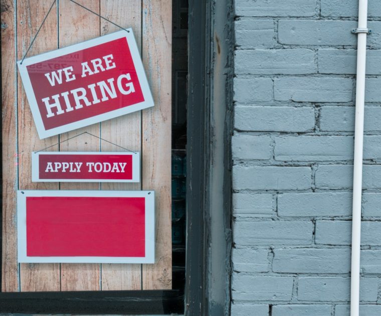 a sign that says we are hiring and apply today
